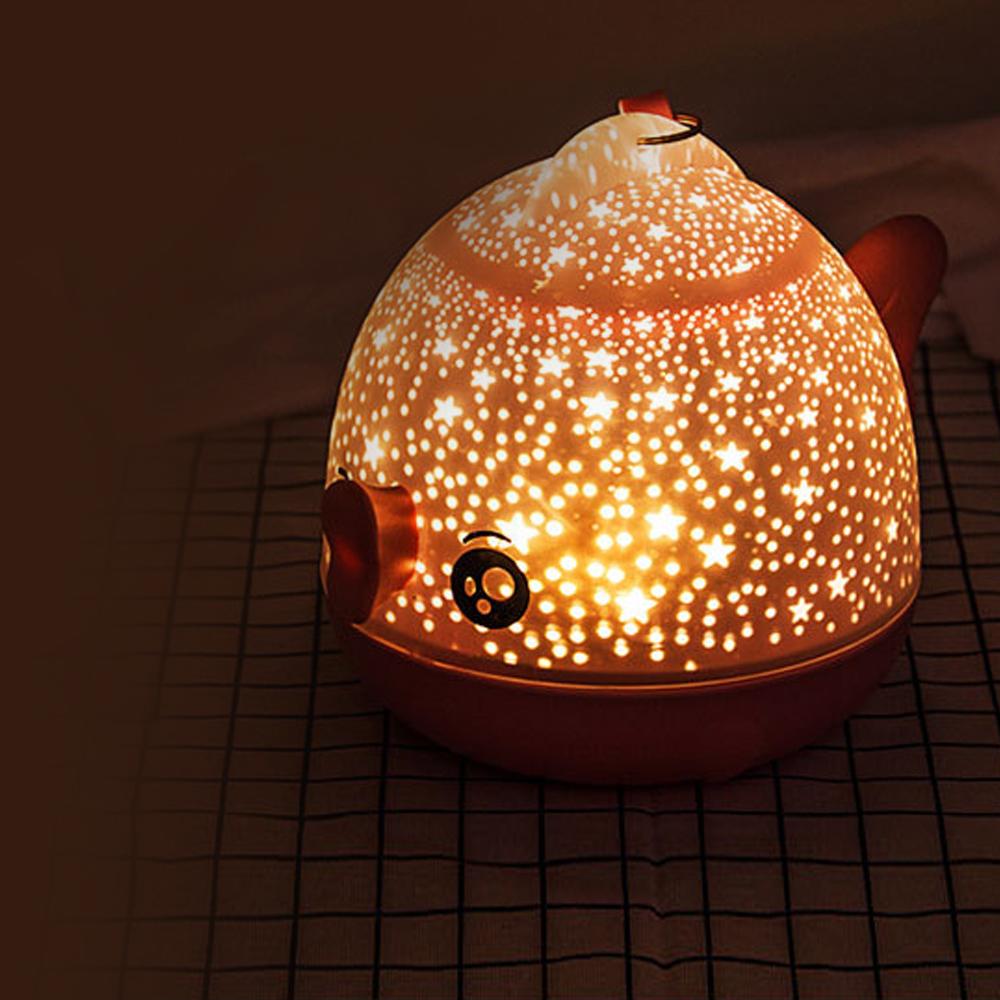 Lucky Fish LED Night Light projecting warm, starry light; a unique room decor and gift for kids.