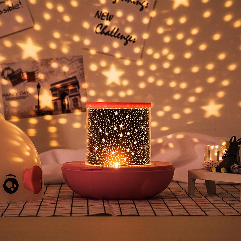 Lucky Fish LED Star Projector Night Light projecting warm starry light, room decor for kids.